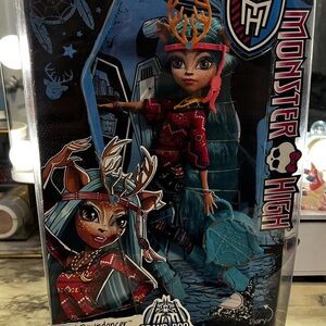 Monster High Doll with Teal Hair and Red Outfit